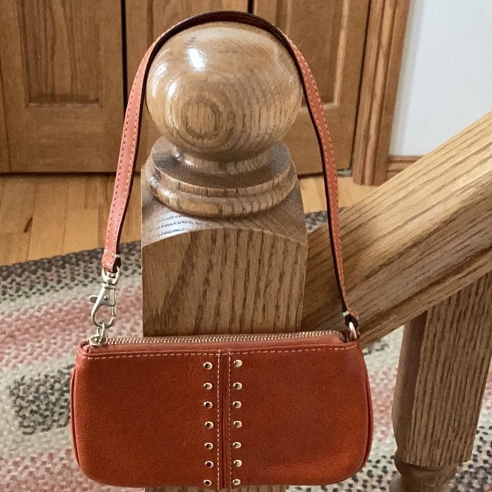 Michael Kors orange, gold tone Studded wristlet, clutch, zipper pouch